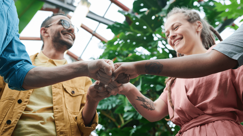 photo of people having fist bump