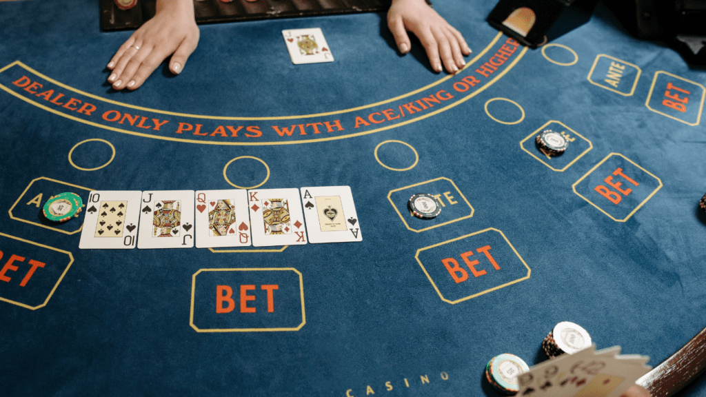 cards and casino tokens on baccarat table